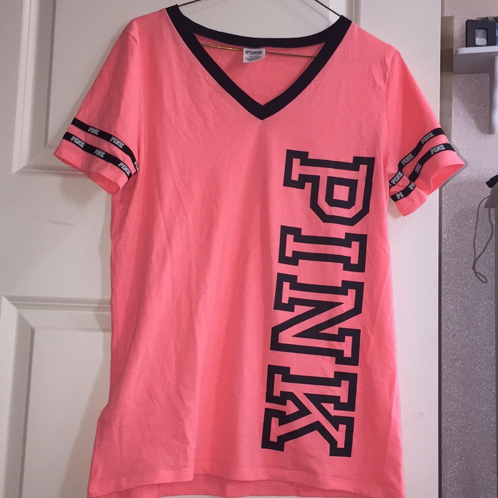 Salmon colored PINK shirt with black accents